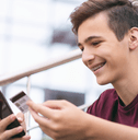 Teen boy with credit card