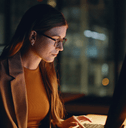 Woman looking at stocks on computer