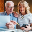 Older couple looking at their finances
