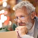Older man reading something on the computer screen