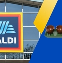Aldi sign with football themed serving tray