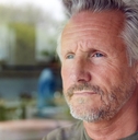 Portrait of a mature man looking out the window
