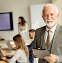 Older business man in a conference room