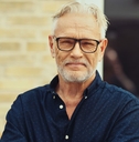 Portrait of a man in his 60s in glasses