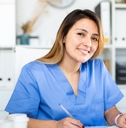 Female physician assistant working at desk
