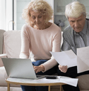 Older couple looking at paperwork