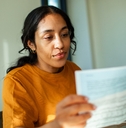 Woman looking at tax document