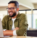 Man smiling working remotely 