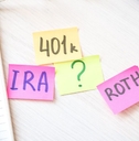 IRA, 401(k), Roth written on colorful sticky notes