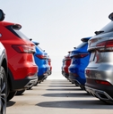 Row of colorful SUVs parked