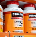 Bottles of Kirkland Signature Vitamin C on Costco's shelf