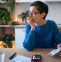 Woman looking worried about debt and bills