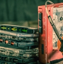 Walkman with headphones and cassette tapes
