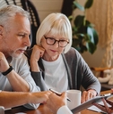 Elderly reviewing paperwork