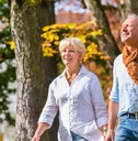 Older couple walking outdoors