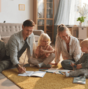 Young family playing on floor