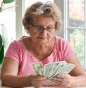 Older woman counting cash