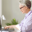 Woman sitting at home desk