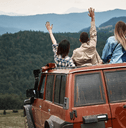 Friends enjoying view from truck