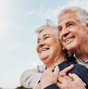 Happy elderly couple hugging