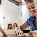 Woman on laptop with credit card