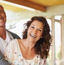 Hugging, smiling couple in their 50s