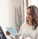 Mature woman reviewing a letter