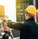 Workers in hard hats on a job site