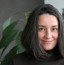 Woman in her 40s smiling at camera
