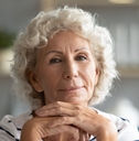 Portrait of a senior woman with her hands under her chin