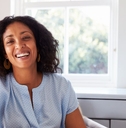 Smiling woman in her 40s with a blue top