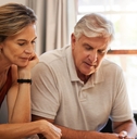 Retired couple looking at finances