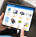 Man online shopping on tablet at home