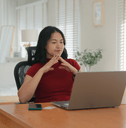 Young woman on computer reading reviews before purchasing