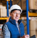 Senior man working in warehouse