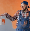 Man looking at paint