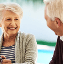 Older couple enjoying breakfast on their patio