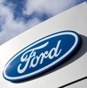 Ford dealership sign against blue sky