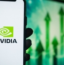 Hand Holding Phone with NVIDIA (NVDA) Logo