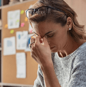 Woman looking at computer stressed out