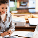Woman using calculator and computer