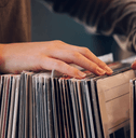Going through vinyl records at store