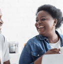 Retired couple on laptop reviewing expenses