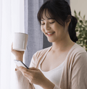 Woman checking savings account interest on phone