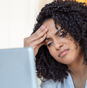 Woman looking confused at computer