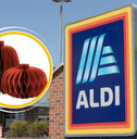 Aldi paper pumpkins in front of storefront
