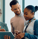 Financial advisor with young couple going over savings account