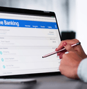 Woman checking online banking on tablet