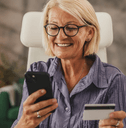 Woman in her 50's with credit card online shopping