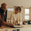 Woman signing contract for kitchen remodel